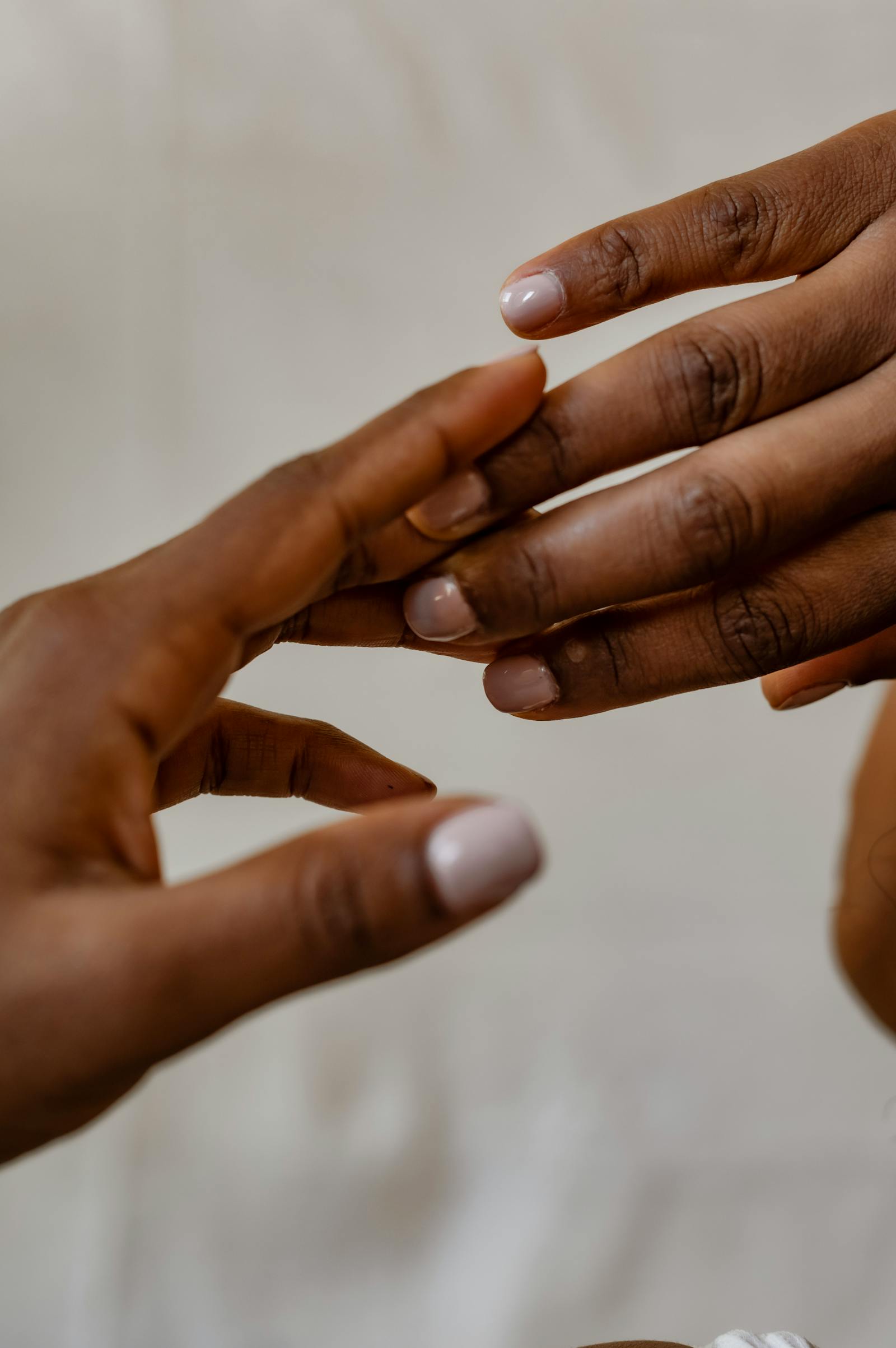 A finished multi-finish manicure on a knit sleeve